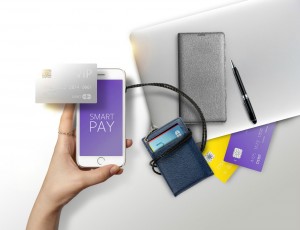 노트북과 볼펜, 신용카드 여러장, 신용카드지갑과 휴대폰이 불규칙하게 놓여져있고 신용카드와 휴대폰이 선으로 연결되어 있다.